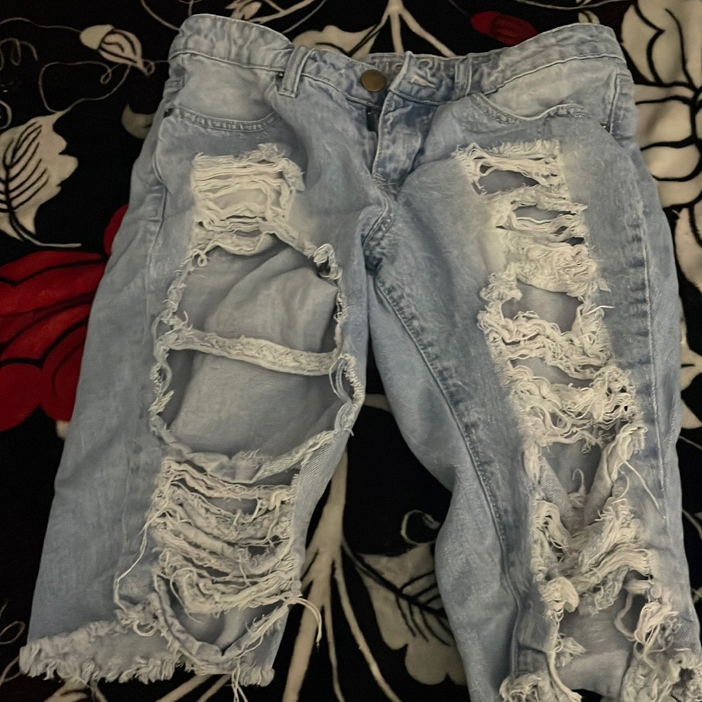 Light washed ripped shorts. Knee shorts